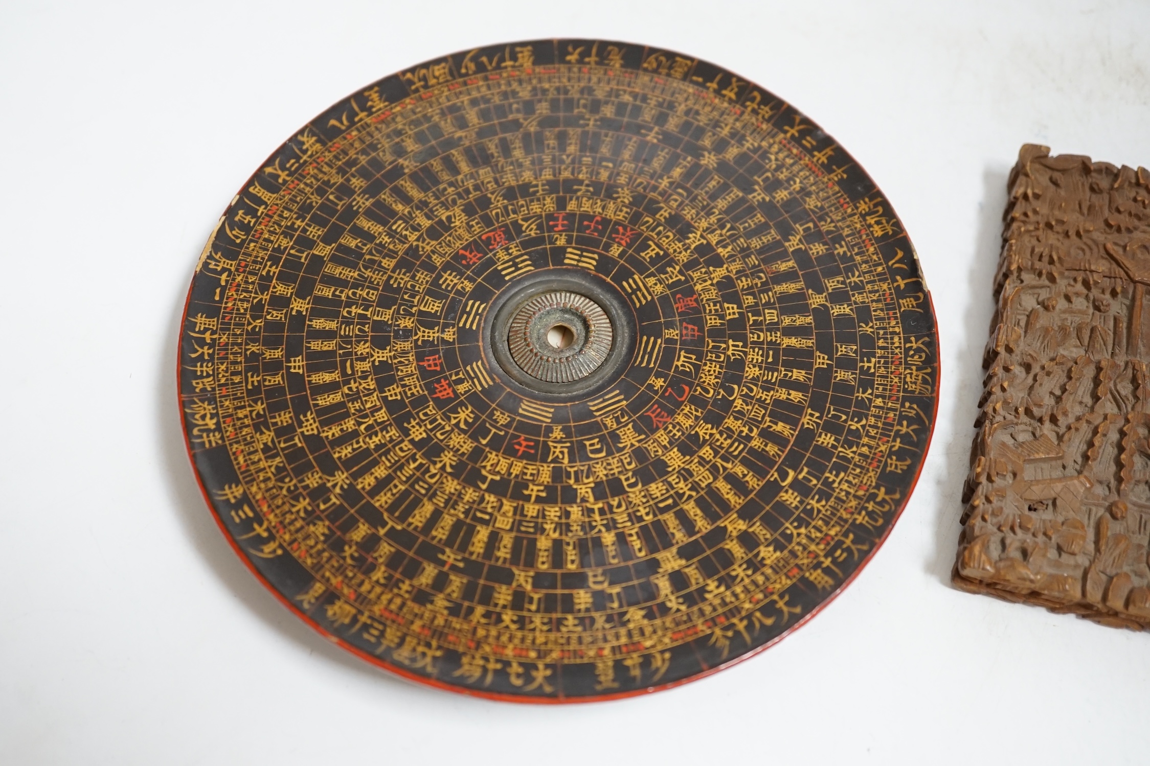 A Chinese sandalwood card case, carved with figures and Chinese Feng Shui lacquered compass, largest 14cm in diameter. Condition - fair, compass lacking